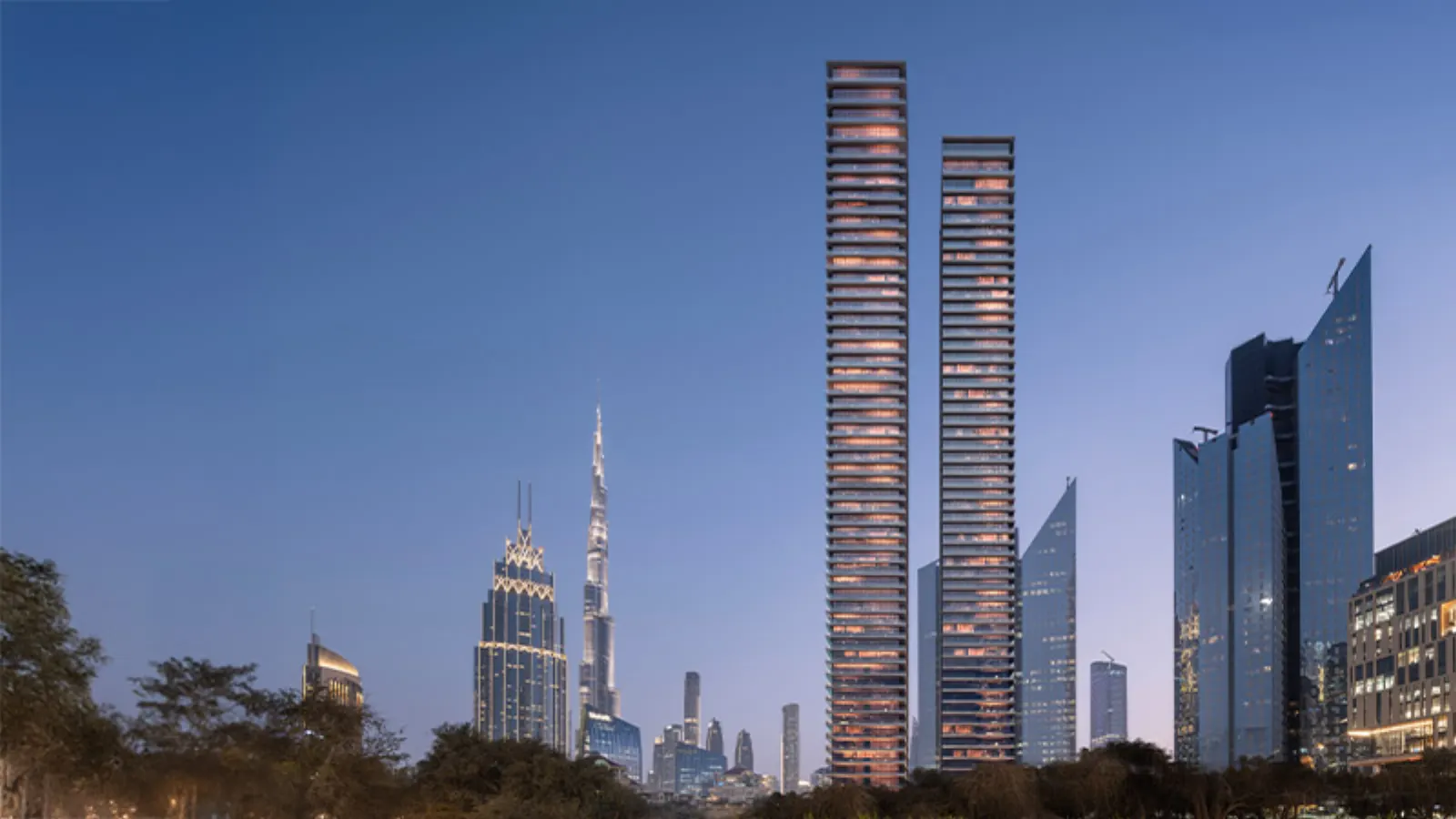 Akala, twin tower exterior at dusk with Burj Khalifa