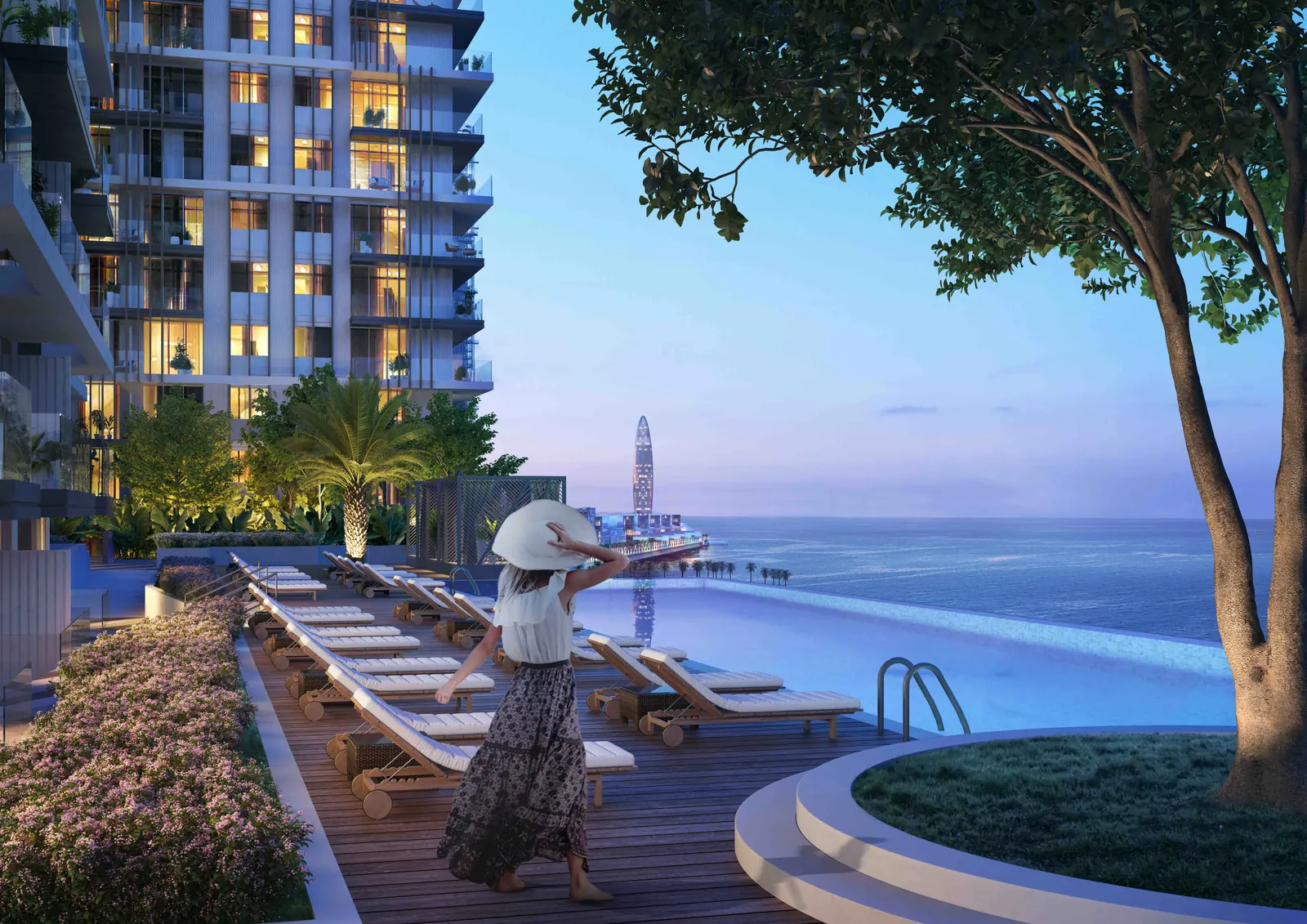 Beach Isle tower facade lit at dusk above its infinity pool deck facing the sea