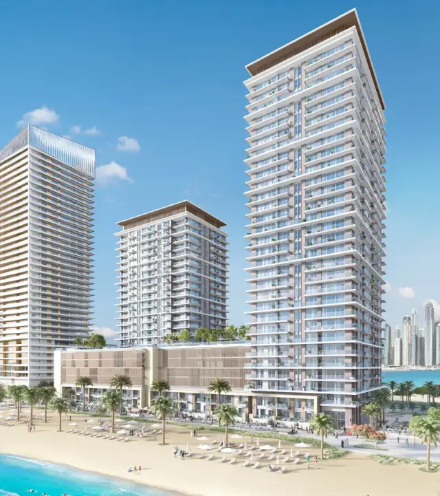 Beach Isle residential towers on the private beach of Emaar Beachfront under a clear sky
