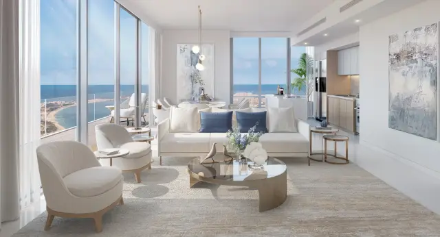 Beach Isle living room with floor to ceiling windows and sea views