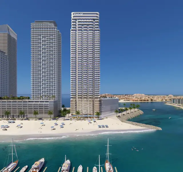 Beachgate by Address towers rising above the beach and marina of Emaar Beachfront