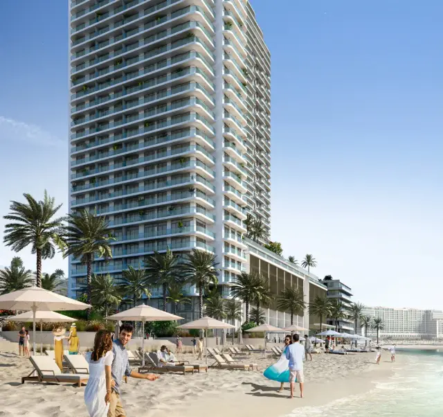 Beachgate by Address tower seen from its private beach with sun loungers and parasols