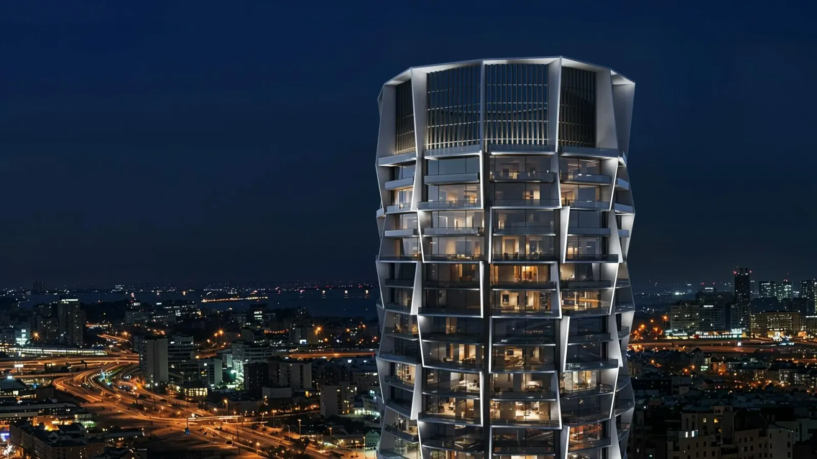 Binghatti Circle tower facade at night above the city skyline