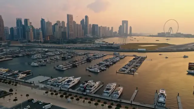 Dubai Harbour Residences marina and Dubai Marina skyline at dusk