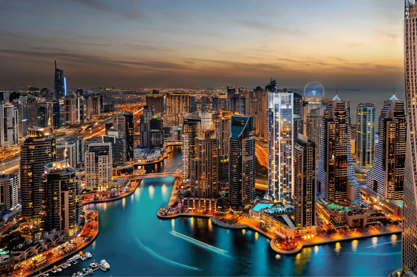 Liv Marina tower aerial view over Dubai Marina at dusk