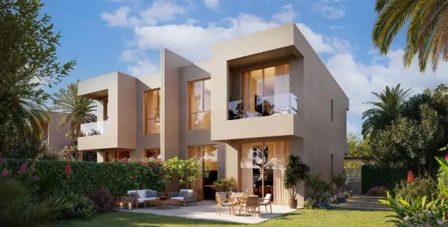 Three bedroom duplex exterior on a palm-lined street