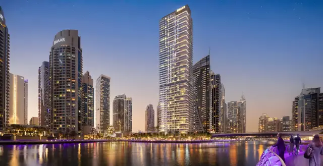 Marina Shores tower at dusk above Dubai Marina promenade