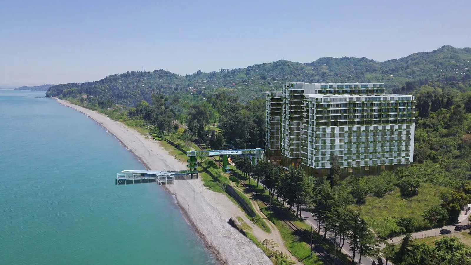 Aerial view of Mziuri Gardens on the green Makhinjauri coastline, with its pier and pebble beach
