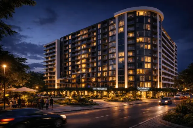 OXY Residence and Occidental Hotel exterior at night