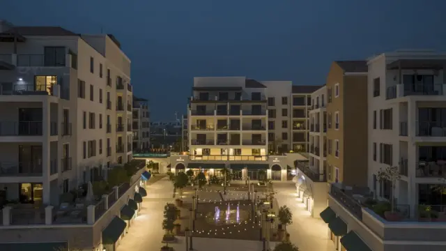 Port de La Mer retail courtyard and fountain at night