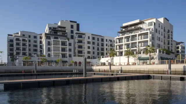 Port de La Mer waterfront buildings and marina promenade, daytime