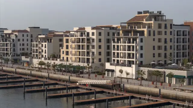 Port de La Mer marina buildings at golden hour