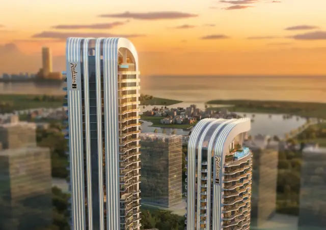 Radisson Blu Hotels RAK Central twin towers at sunset