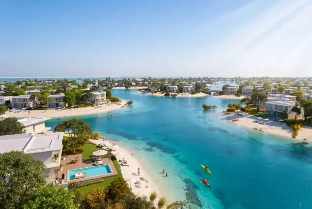 Aerial view of villa islands and lagoon with kayakers