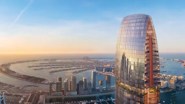 Six Senses Residences Dubai Marina tower exterior above the Palm Jumeirah skyline