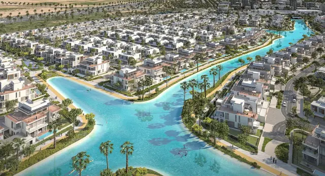 Aerial render of South Bay villas and townhouses lining the swimmable Crystal Lagoon in Dubai South