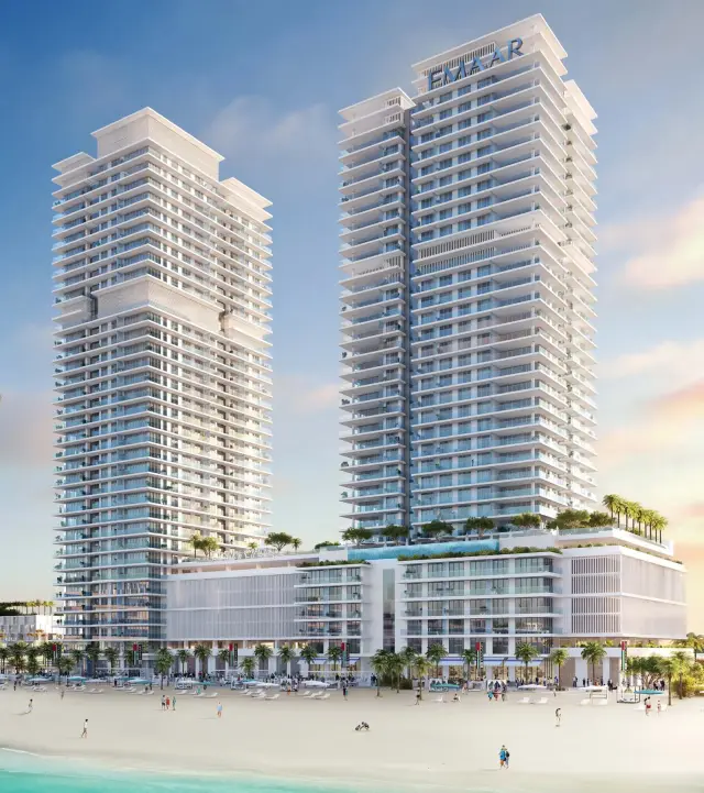 Sunrise Bay twin residential towers above their podium and private beach